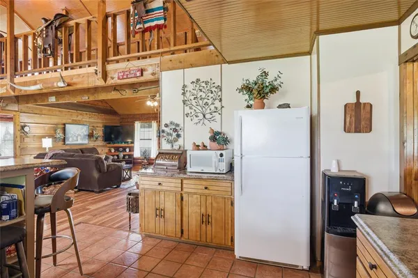 a kitchen with a sink and a refrigerator