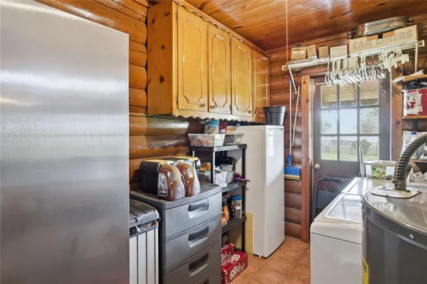 a kitchen with a refrigerator and washer