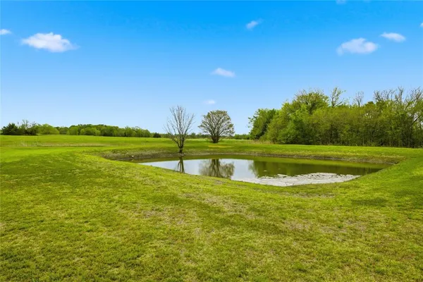 a view of a swimming pool with an outdoor space and seating area