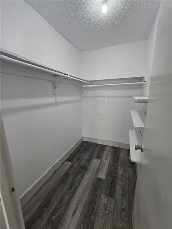 a view of a room with racks on the wall