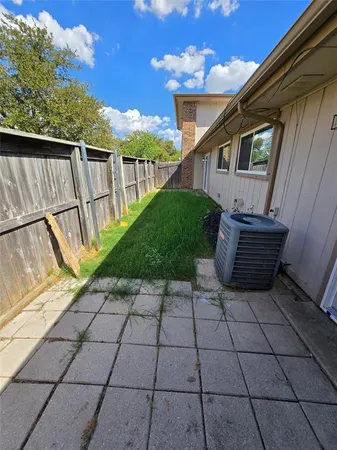 a view of a backyard with sitting area