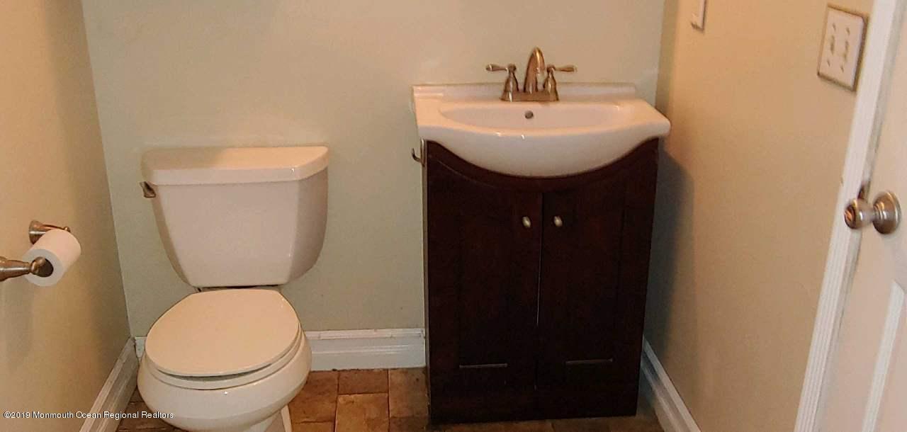 86 Port Road Brick, NJ 08723 - Photo 6 of 7 a bathroom with a toilet and a sink