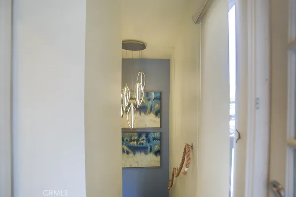 a picture of a bathroom with mirror and door