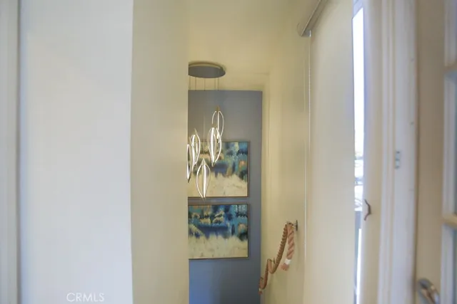 a picture of a bathroom with mirror and door