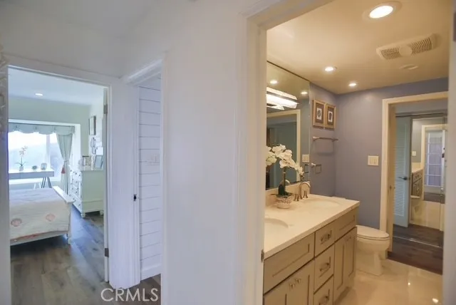 a bathroom with a sink a mirror and a shower
