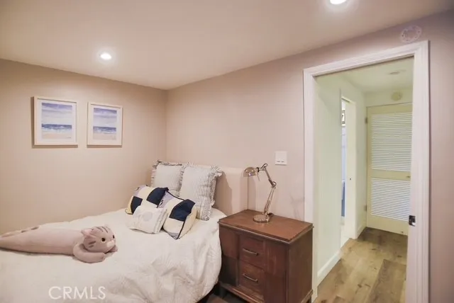 a bedroom with a bed and a table in it