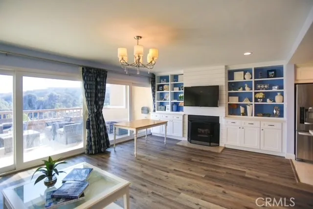 a living room with fireplace furniture and a flat screen tv