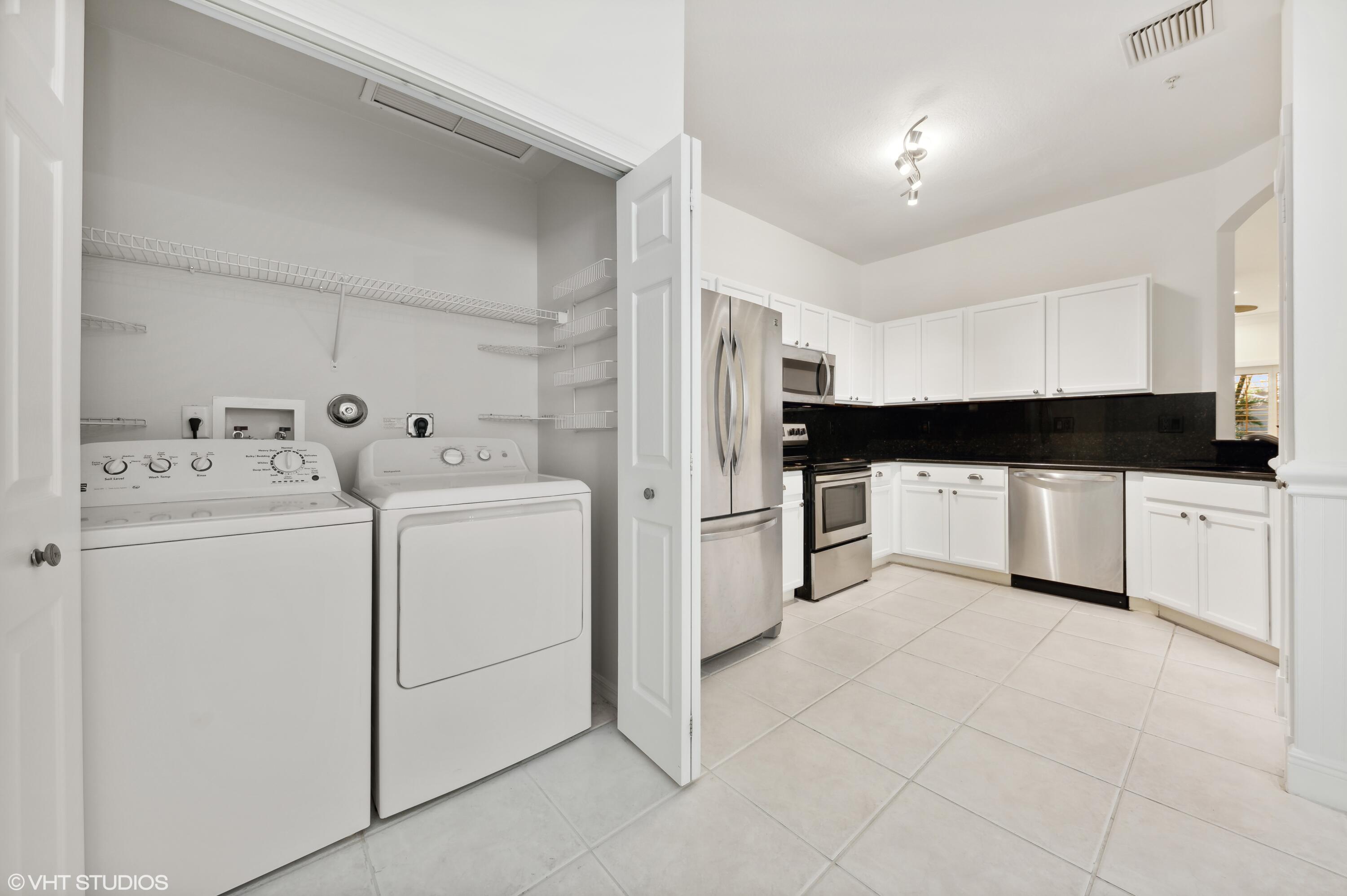 103 Lighthouse Circle, Unit D Tequesta, FL 33469 - Photo 28 of 36 LAUNDRY ROOM CENTER IN KITCHEN