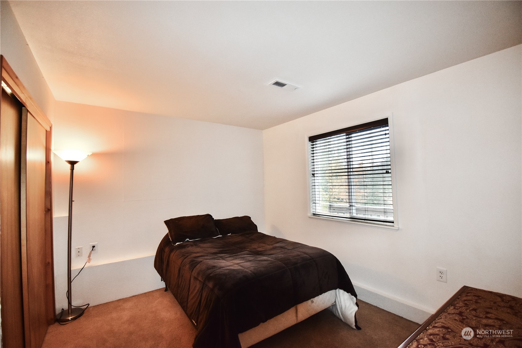 738 W Road Sedro-Woolley, WA 98284 - Photo 13 of 17 a bedroom with a bed and a window