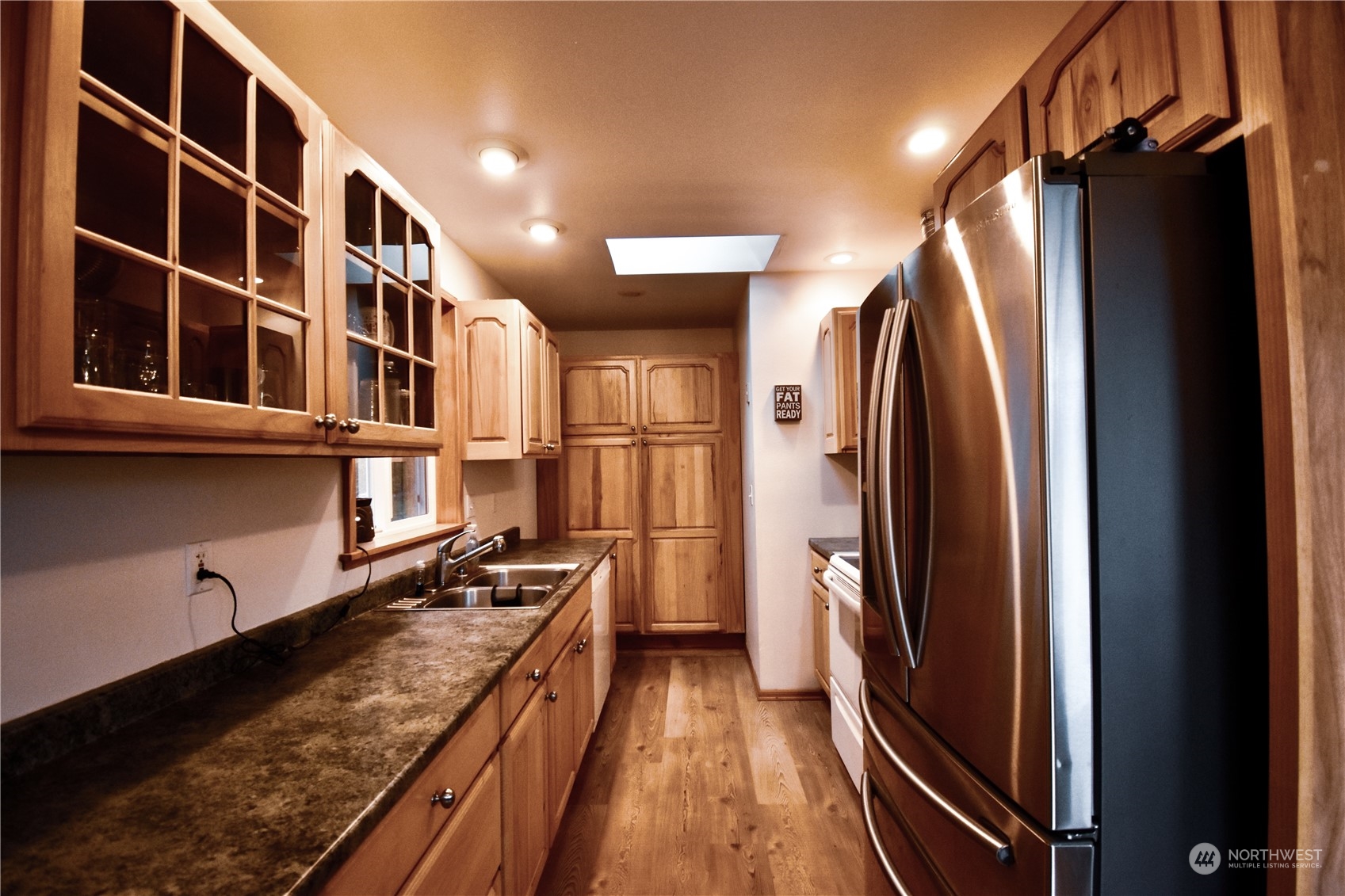 738 W Road Sedro-Woolley, WA 98284 - Photo 5 of 17 a view of a refrigerator and wooden floor