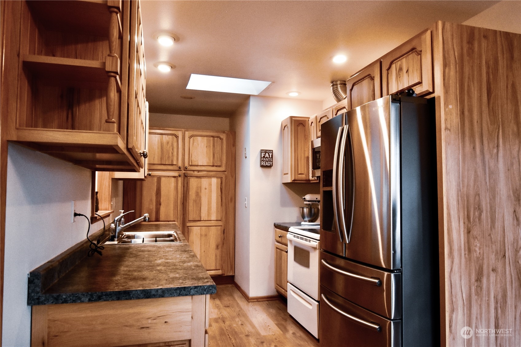 738 W Road Sedro-Woolley, WA 98284 - Photo 6 of 17 a kitchen with a refrigerator and a sink