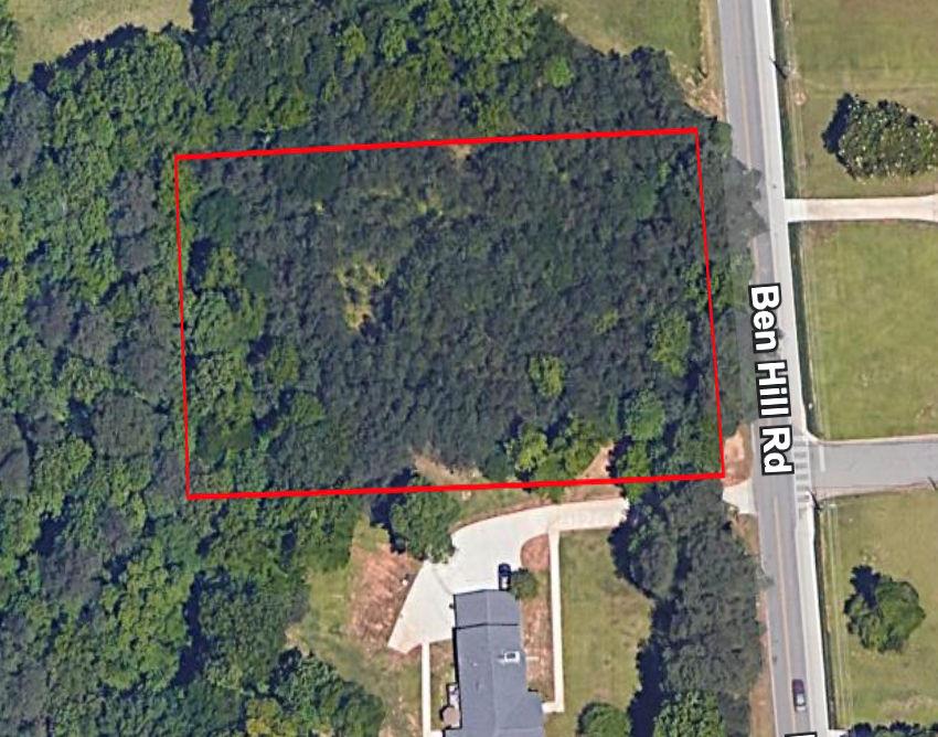 a street sign that is sitting in front of a building