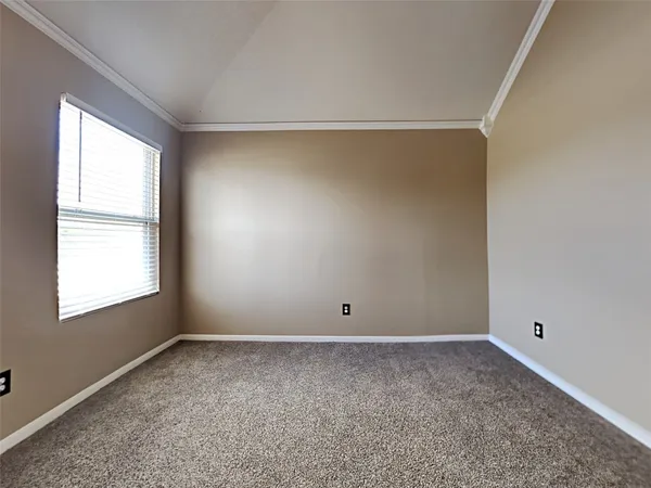 an empty room with a empty space and windows