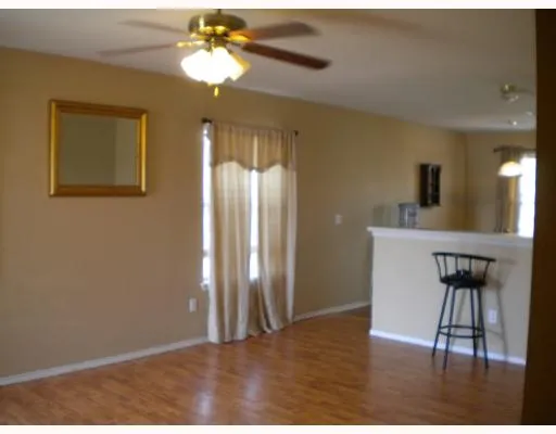 a view of a livingroom with a kitchen
