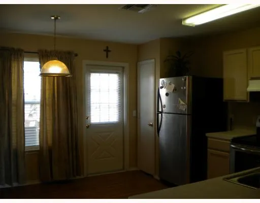 a bathroom with a glass shower door and a mirror