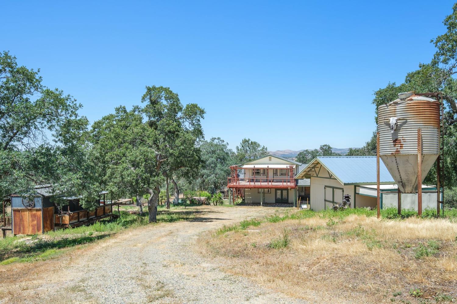 37667 Eagle Drive Raymond, CA 93653 - Photo 1 of 43 a view of a house with outdoor space and sitting area