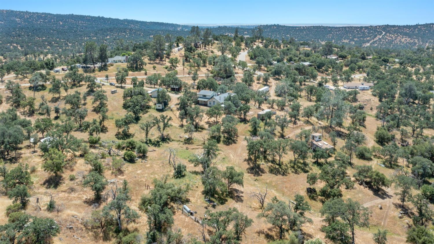 37667 Eagle Drive Raymond, CA 93653 - Photo 40 of 43 a view of a city with lush green forest