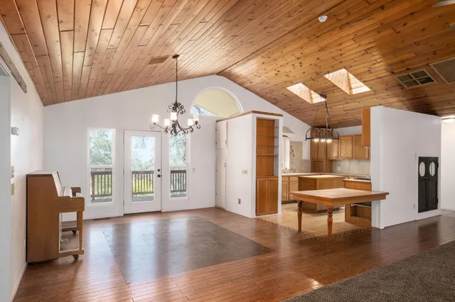 a view of a livingroom with furniture and wooden floor