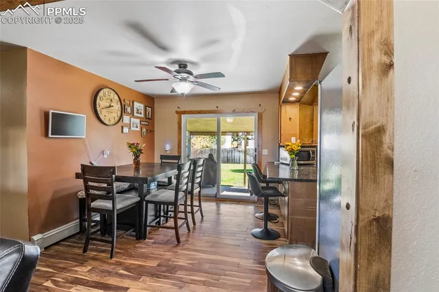 a view of a dining room with furniture window and wooden floor