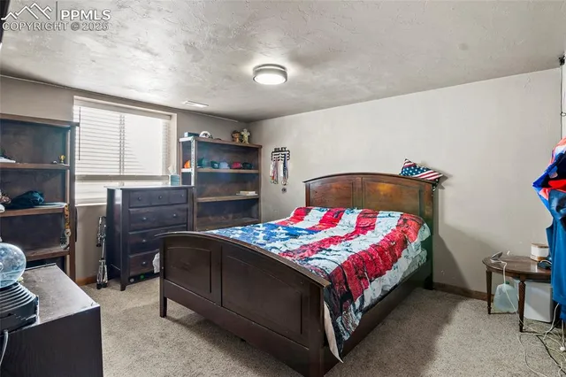 a bedroom with a bed and a closet