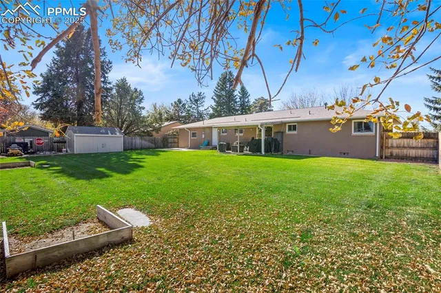 a view of a house with a yard porch and sitting area
