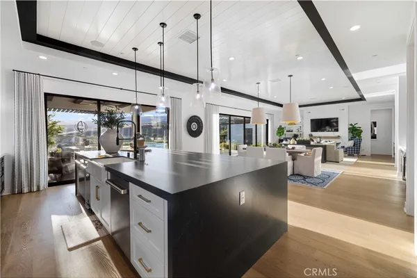 a kitchen with stainless steel appliances granite countertop a lot of counter space