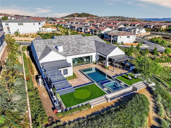 an aerial view of a house with a big yard
