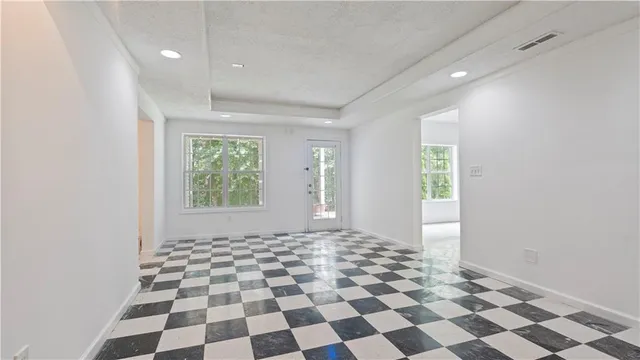 a view of a big room with windows and mountain view