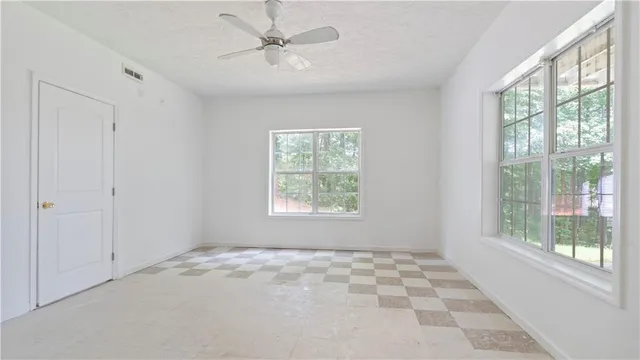 a view of an empty room and window