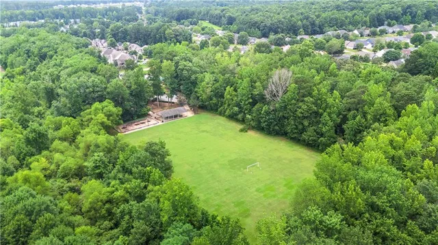 a view of a garden with a building