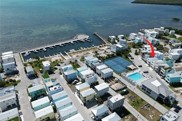 an aerial view of a house with a lake view