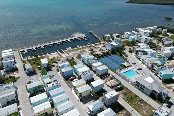 an aerial view of residential houses with outdoor space