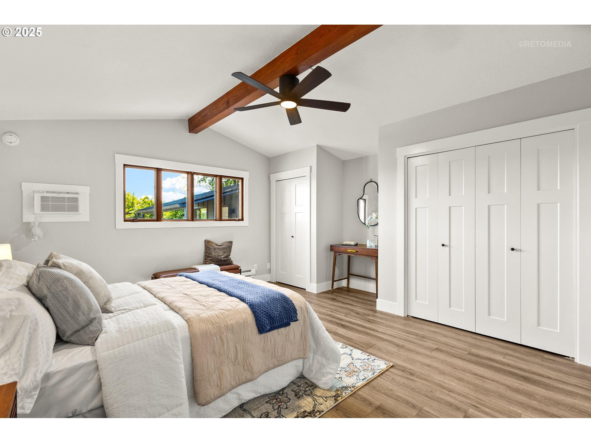 22645 Southwest Chapman Road Sherwood, OR 97140 - Photo 16 of 48 a bedroom with a bed and a chandelier