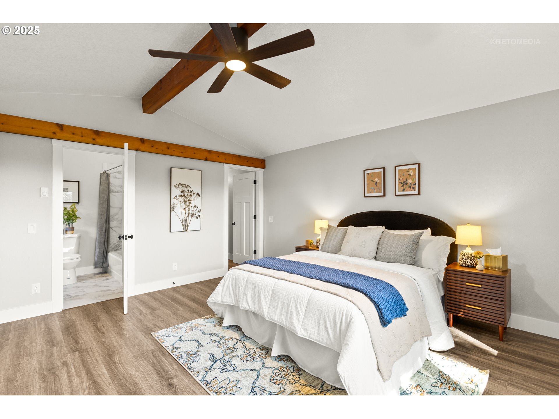 22645 Southwest Chapman Road Sherwood, OR 97140 - Photo 17 of 48 a bedroom with a large bed and a chandelier