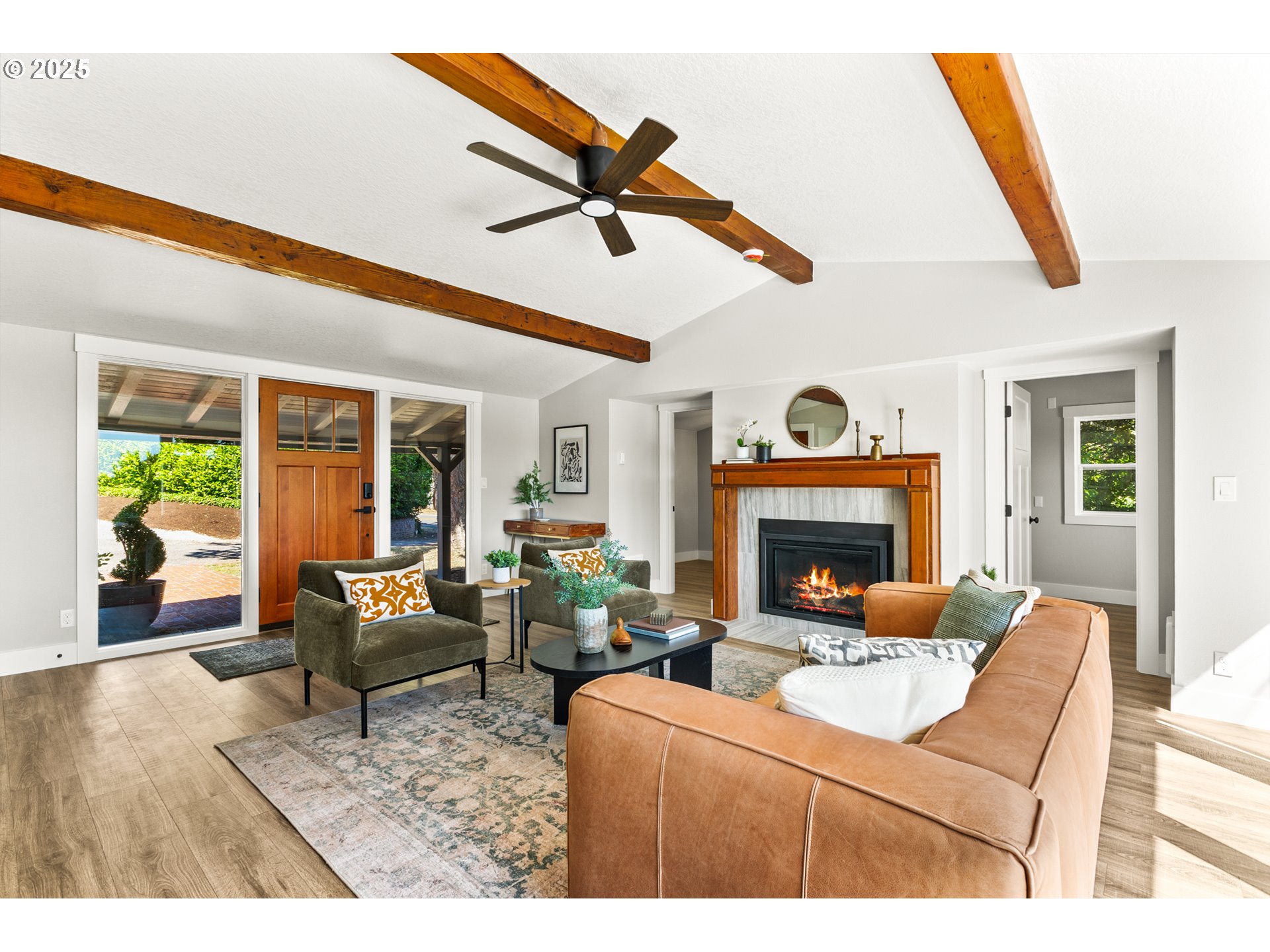 22645 Southwest Chapman Road Sherwood, OR 97140 - Photo 5 of 48 a living room with furniture a fireplace and wooden floor
