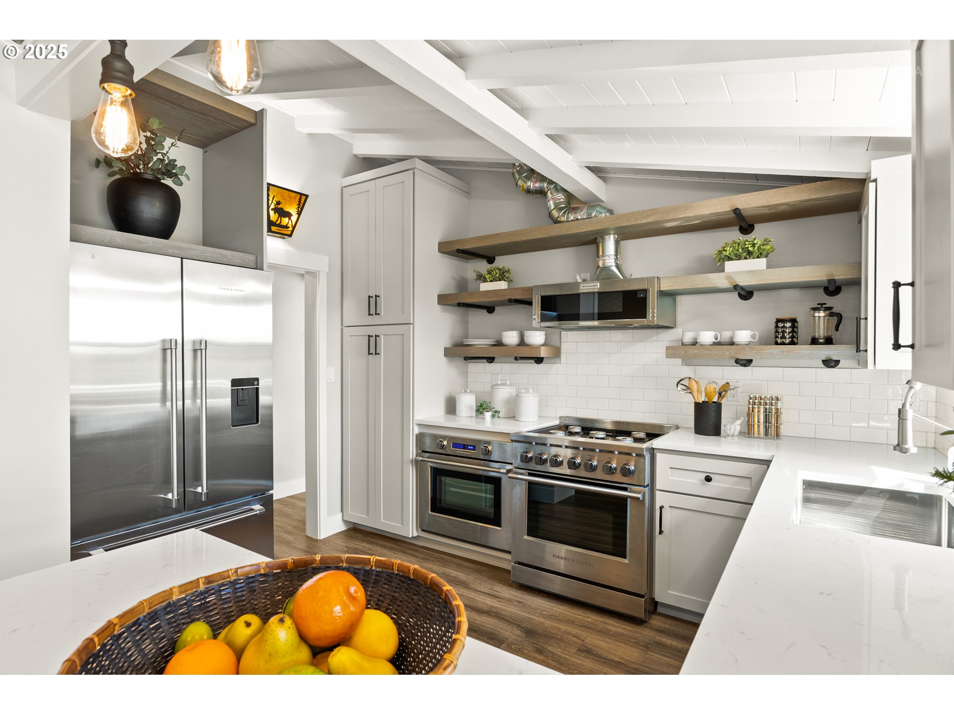 22645 Southwest Chapman Road Sherwood, OR 97140 - Photo 10 of 48 a kitchen with stainless steel appliances granite countertop a stove and a refrigerator