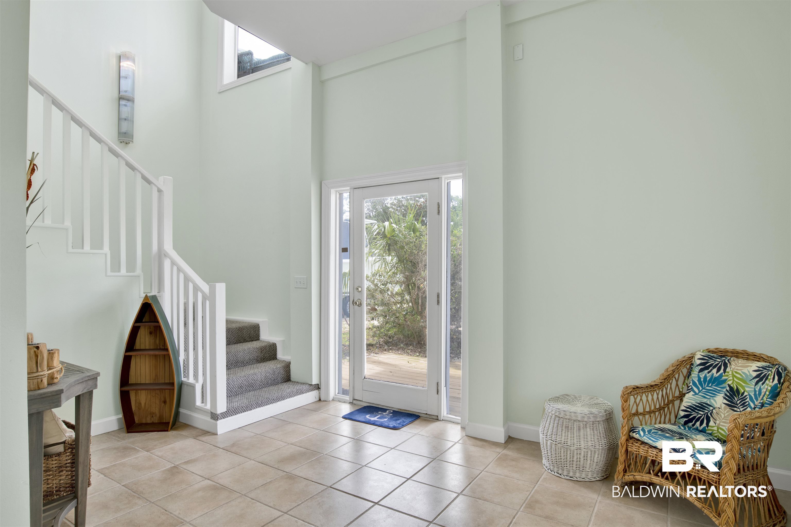 33093 River Road Orange Beach, AL 36561 - Photo 25 of 30 Tiled entryway featuring a high ceiling