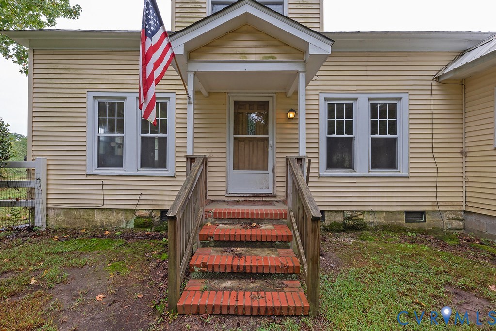 1881 Fairport Road Reedville, VA 22539 - Photo 5 of 54 Wood siding exterior with brick foundation, covere