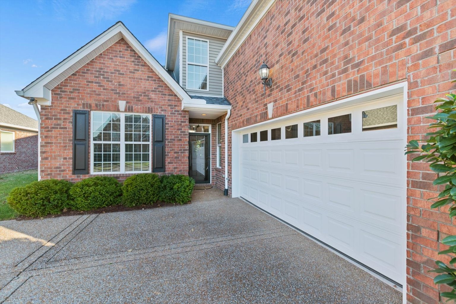 1114 Chickadee Circle Hermitage, TN 37076 - Photo 2 of 39 a front view of a house with a yard and garage