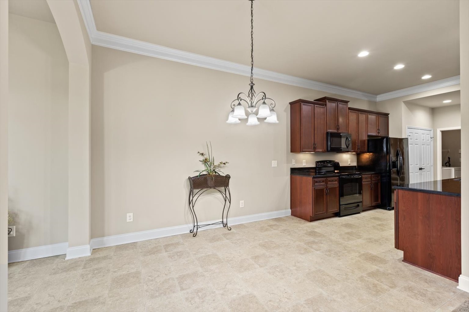 1114 Chickadee Circle Hermitage, TN 37076 - Photo 21 of 39 a kitchen with stainless steel appliances kitchen island granite countertop a refrigerator a stove a sink and a dining table
