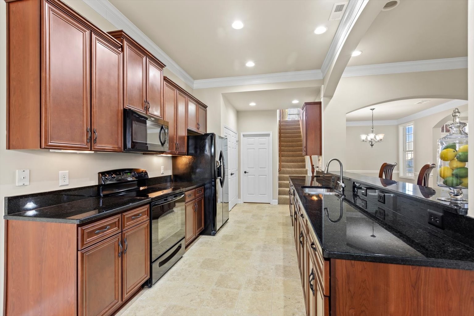 1114 Chickadee Circle Hermitage, TN 37076 - Photo 22 of 39 a kitchen with stainless steel appliances granite countertop a sink a stove and a refrigerator