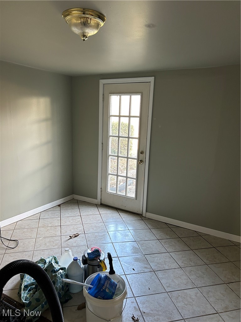 424 Ridge Road North North Fairfield, OH 44855 - Photo 7 of 48 Spare room with light tile patterned floors and baseboards
