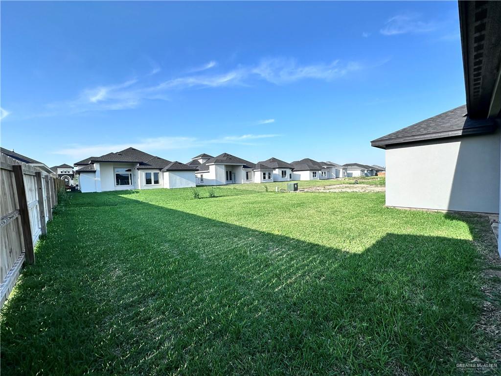 1100 Azalea Street Mission, TX 78573 - Photo 22 of 24 a view of a house with a yard and sitting area