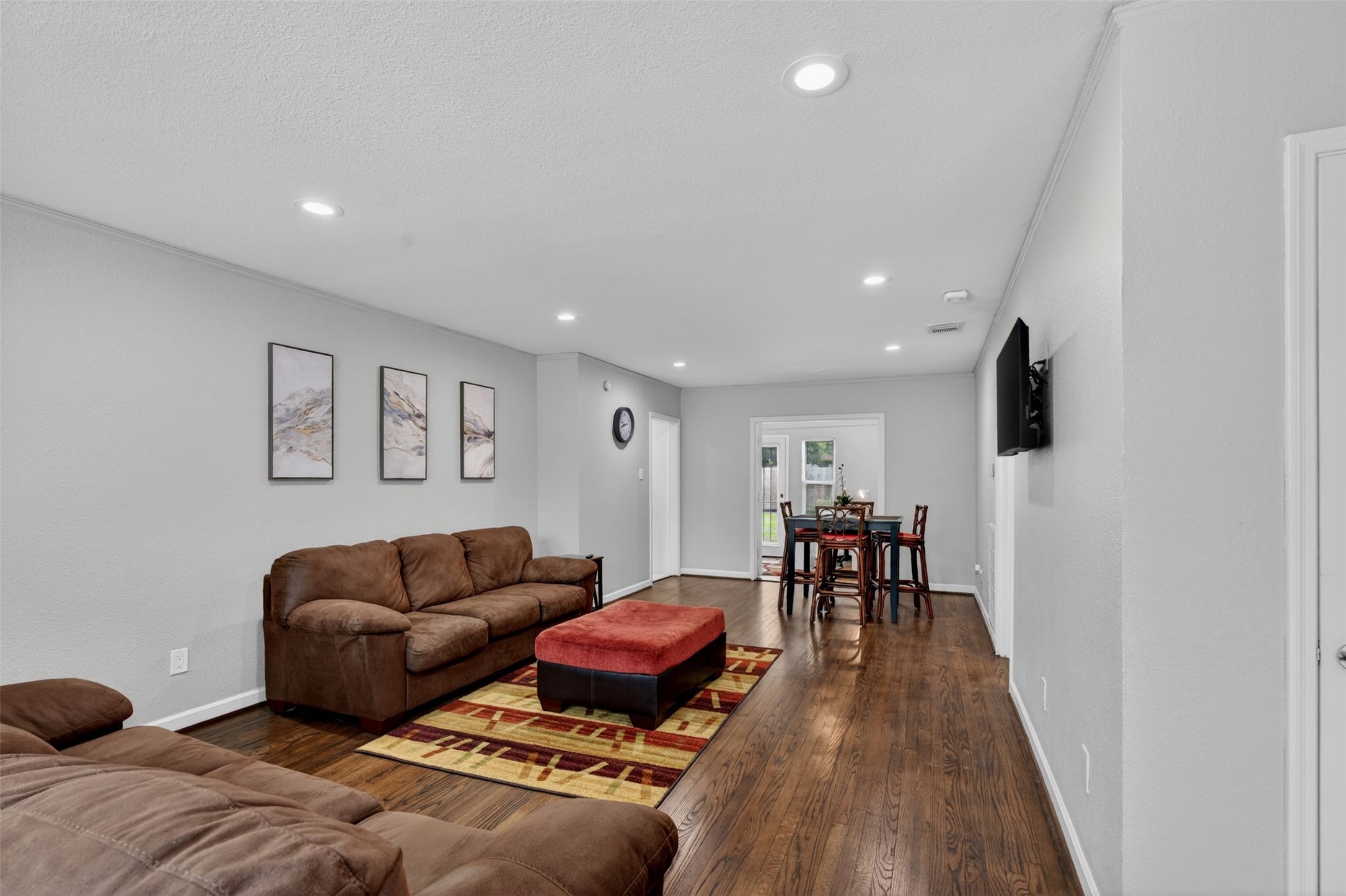 3863 Arbor Street Houston, TX 77004 - Photo 11 of 35 a living room with furniture and a wooden floor