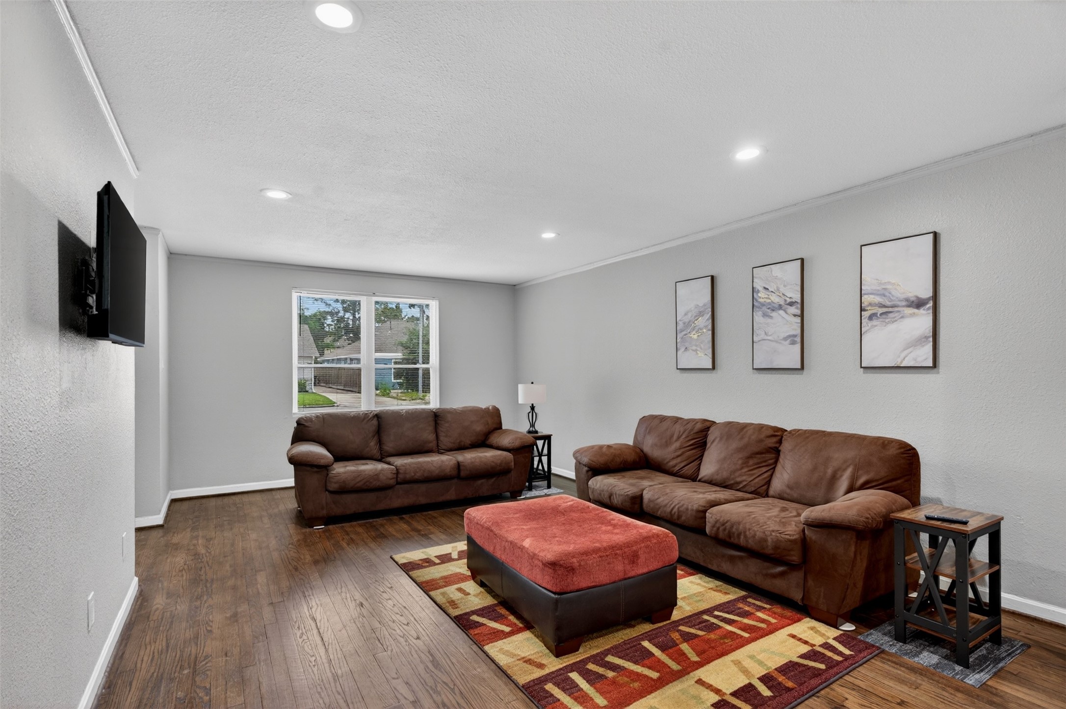 3863 Arbor Street Houston, TX 77004 - Photo 12 of 35 a living room with furniture and a flat screen tv