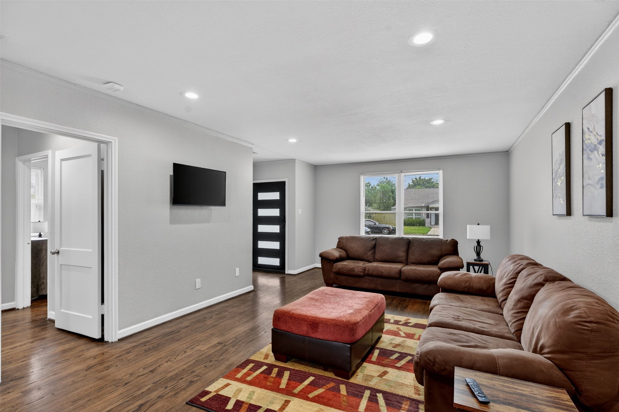 3863 Arbor Street Houston, TX 77004 - Photo 13 of 35 a living room with furniture and a flat screen tv