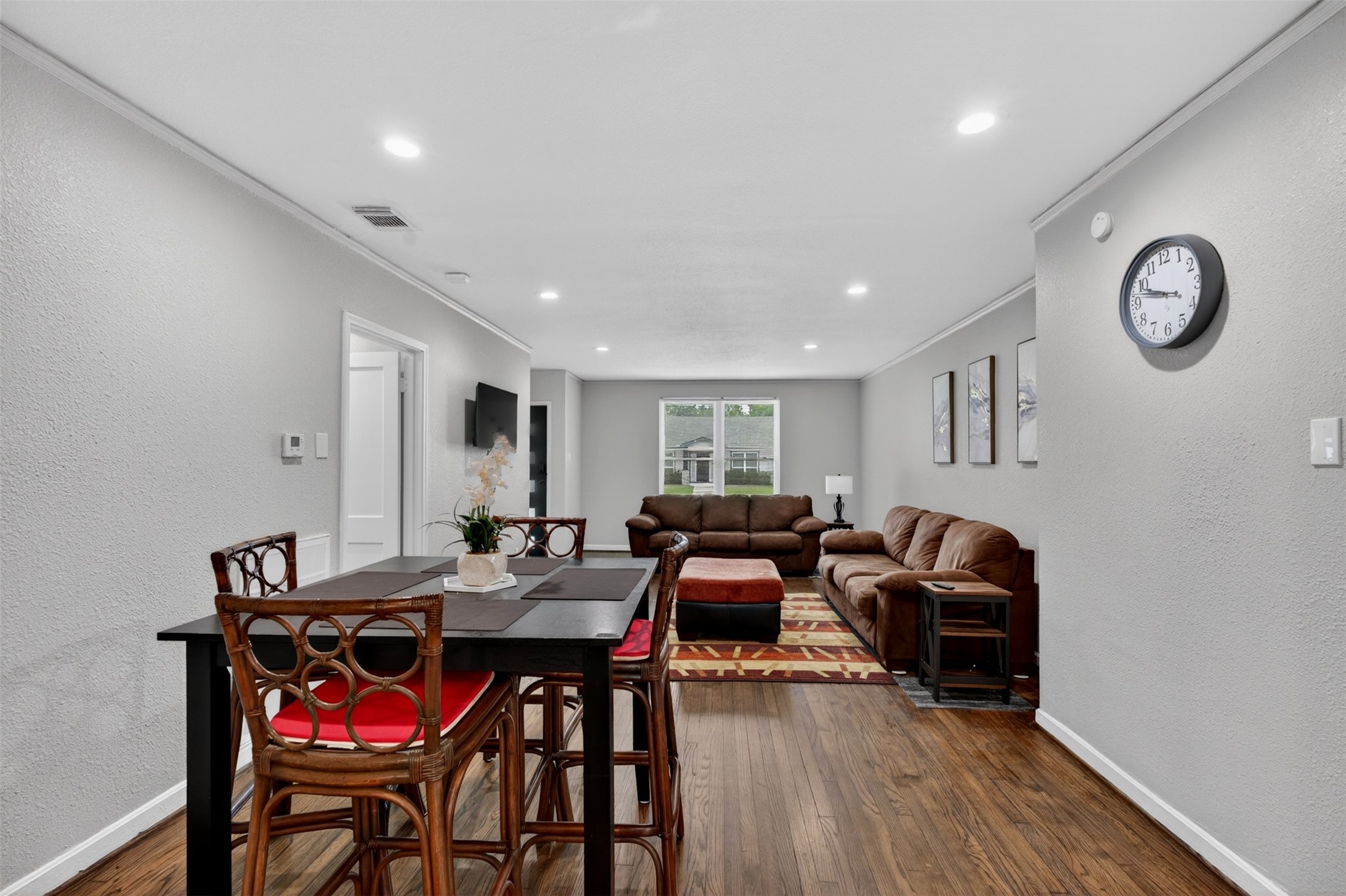 3863 Arbor Street Houston, TX 77004 - Photo 17 of 35 a view of a dining room with furniture and wooden floor