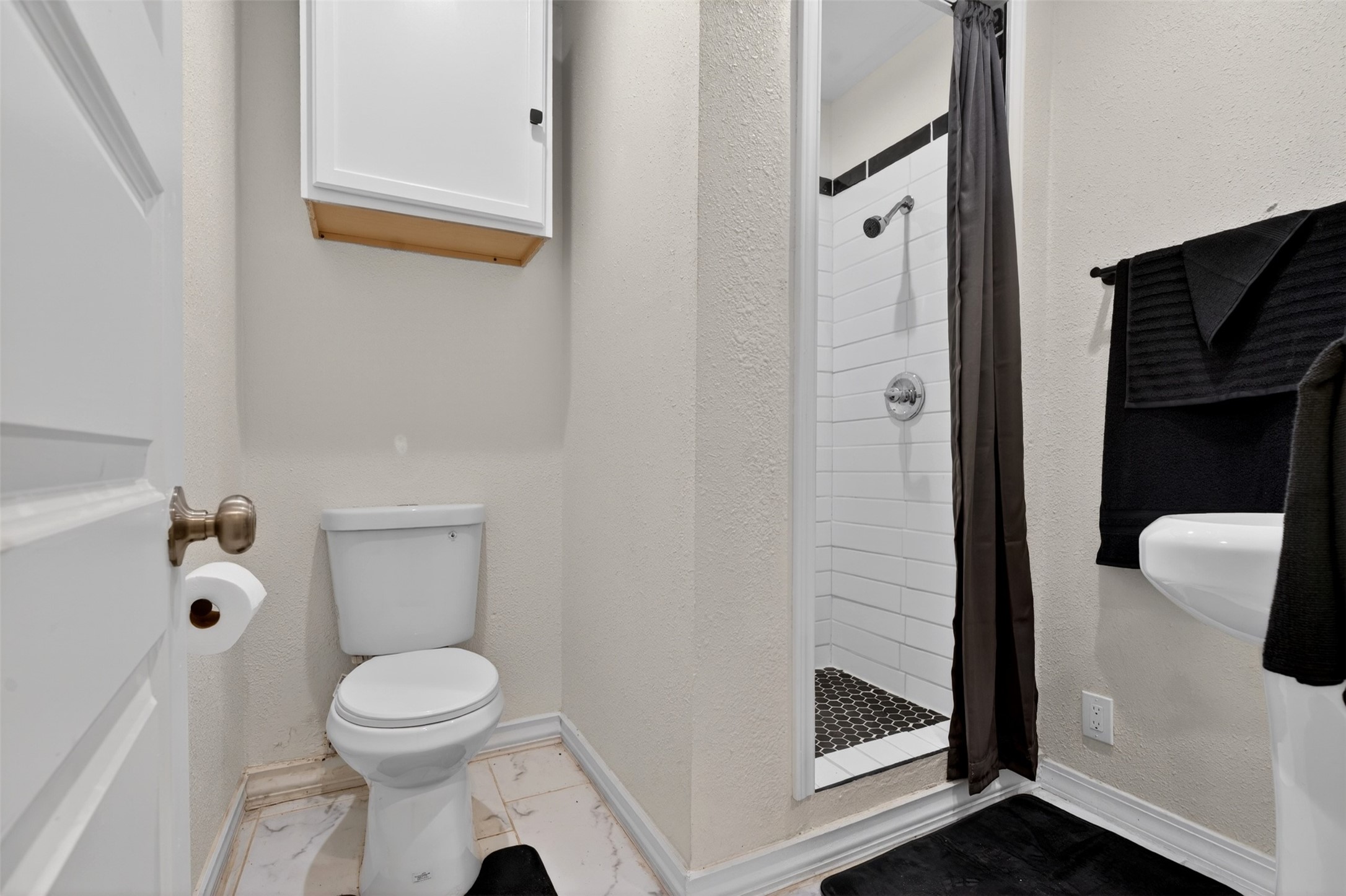 3863 Arbor Street Houston, TX 77004 - Photo 22 of 35 a bathroom with a toilet and a shower