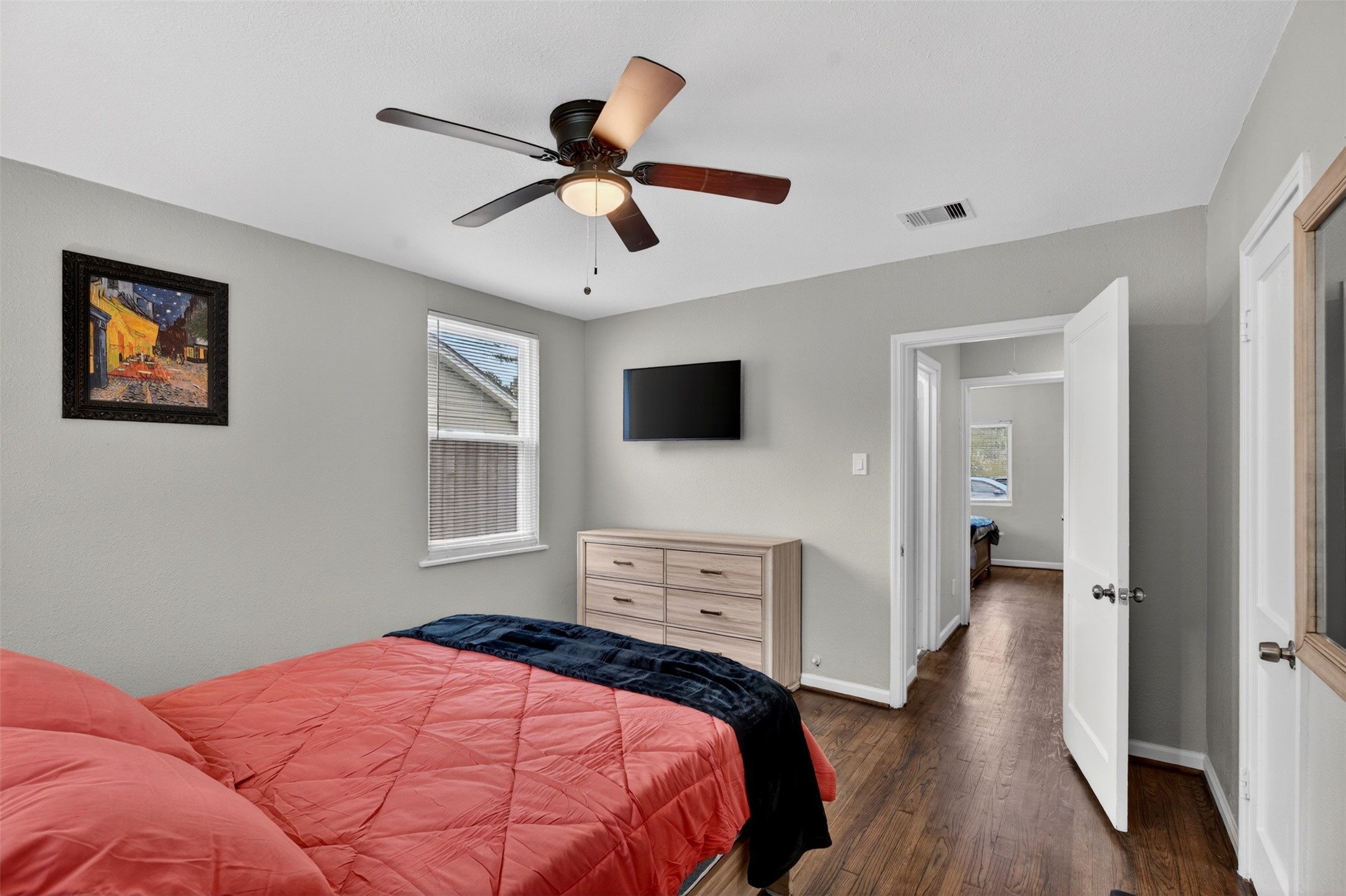 3863 Arbor Street Houston, TX 77004 - Photo 28 of 35 a bedroom with a bed and a flat screen tv