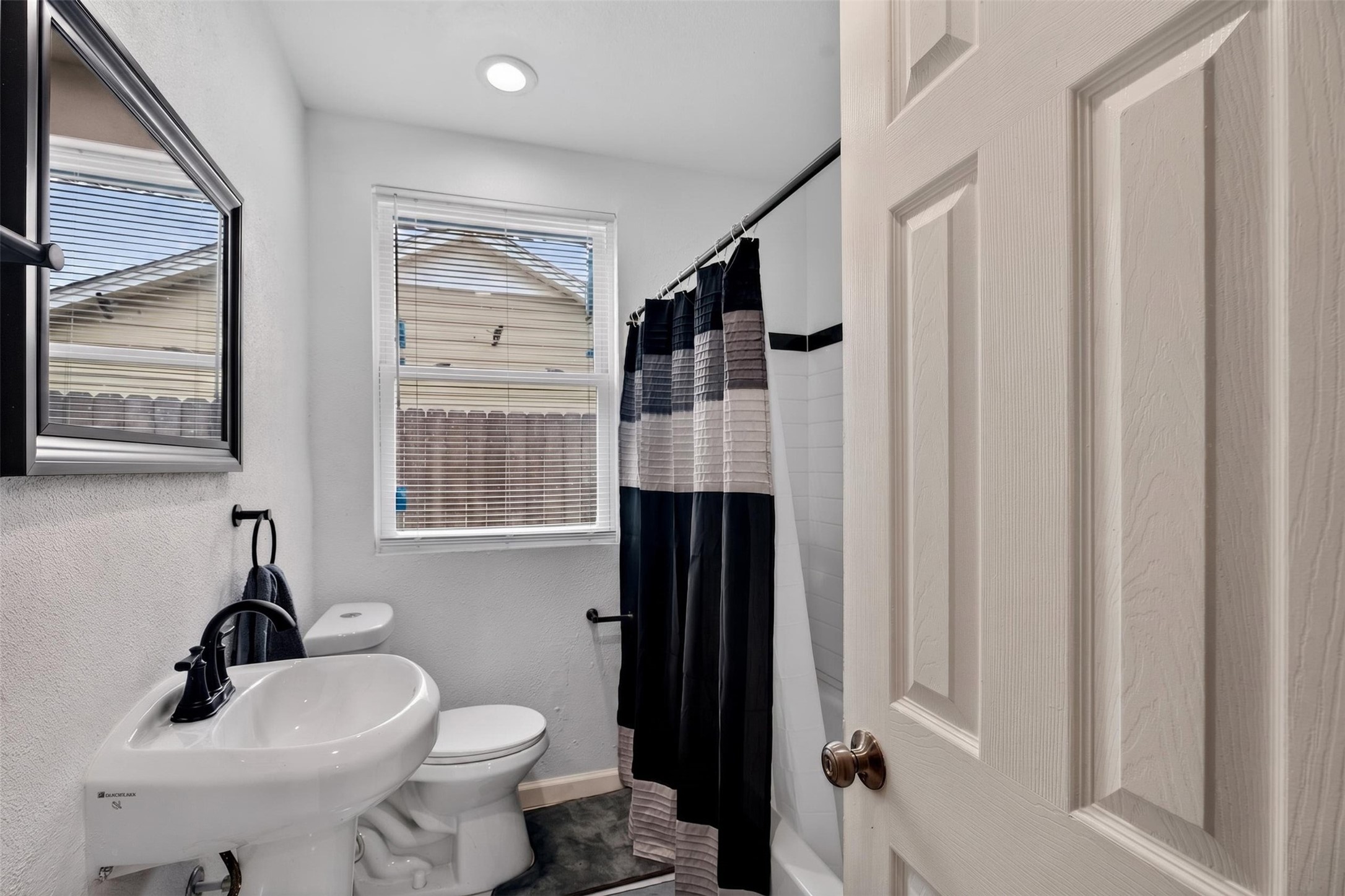 3863 Arbor Street Houston, TX 77004 - Photo 29 of 35 a bathroom with a sink toilet and shower